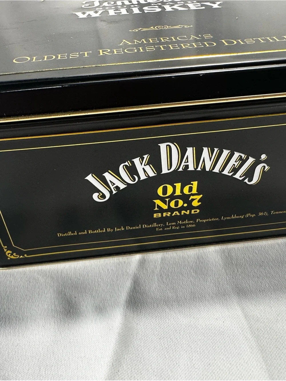 T542. Jack Daniel's Tennessee Whiskey Tin - Black with Red & Gold Accents